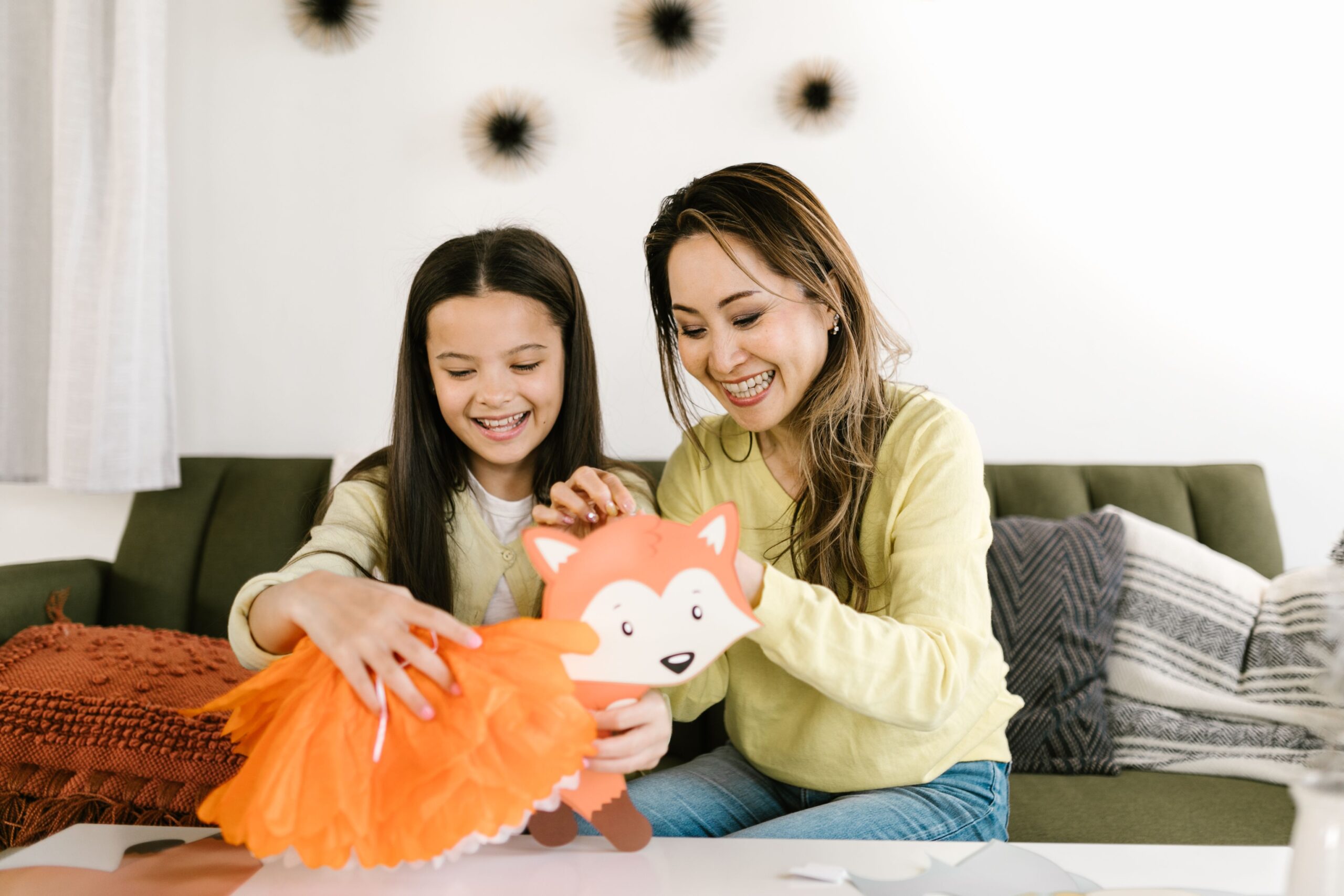 An engaging family moment of craft making, showcasing bonding and creativity.